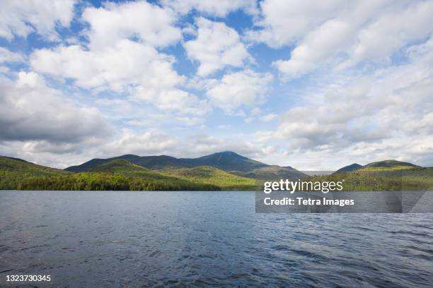 usa, new york, north elba, whiteface mountain with lake placid in foreground - lake placid stock pictures, royalty-free photos & images