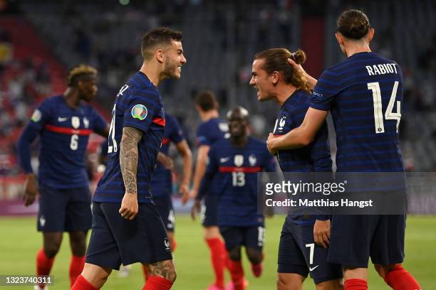 Lucas Hernandez, Antoine Griezmann and Adrien Rabiot of France celebrate their side's first goal, an own goal by Mats Hummels of Germany during the...