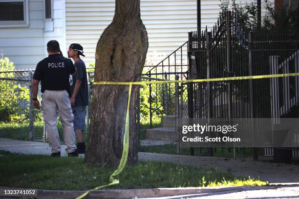 Police secure the scene of a shooting on June 15, 2021 in the Englewood neighborhood of Chicago, Illinois. Four people were killed at a home during...