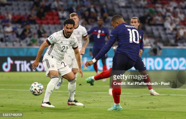 Kylian Mbappe of France scores a goal that is disallowed for offside whilst under pressure from Ilkay Guendogan of Germany during the UEFA Euro 2020...
