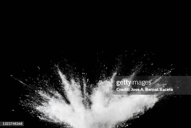 impact and explosion of white dust and smoke particles on a black background. - creative destruction stock pictures, royalty-free photos & images