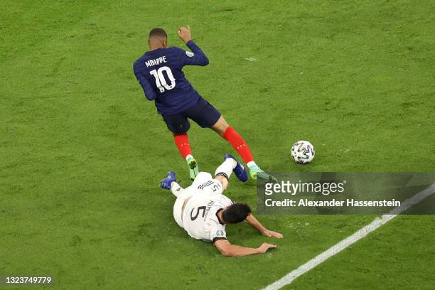 Kylian Mbappe of France is challenged by Mats Hummels of Germany during the UEFA Euro 2020 Championship Group F match between France and Germany at...