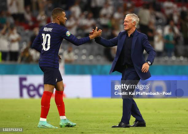 Kylian Mbappe of France shakes hands with Didier Deschamps, Head Coach of France following victory in the UEFA Euro 2020 Championship Group F match...