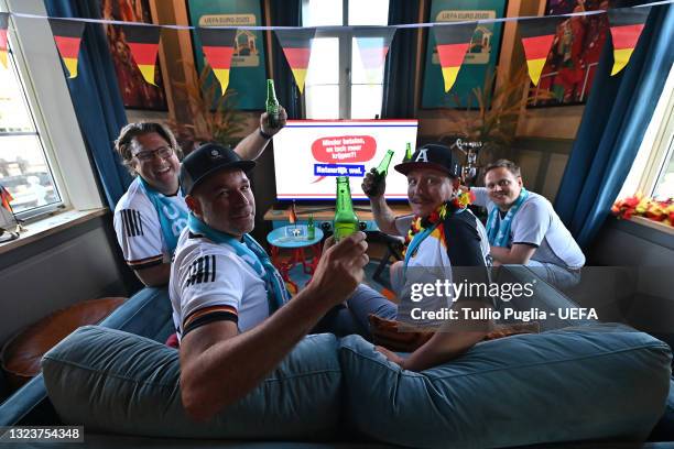 Contest winners fans of Germany are host inside of De Leukste Huiskamer, a Lock Keepers building painted in the Euro 2020 colours and logo, during...