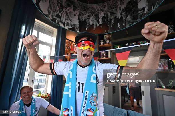 Contest winners fans of Germany are host inside of De Leukste Huiskamer, a Lock Keepers building painted in the Euro 2020 colours and logo, during...