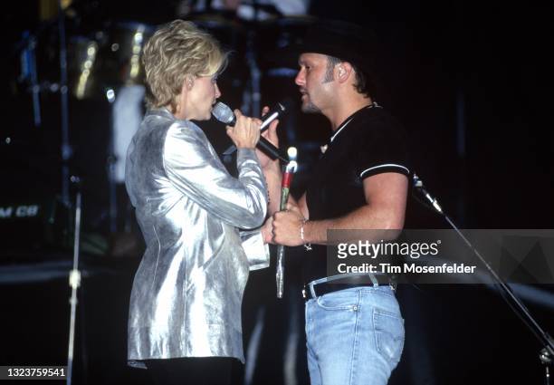 Faith Hill and Tim McGraw perform during the George Strait Music Festival at Oakland Coliseum on April 26, 1998 in Oakland, California.