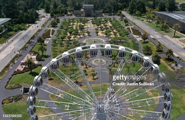 In an aerial view, the SkyStar Wheel in the Music Concourse carries riders at Golden Gate Park on June 14, 2021 in San Francisco, California....