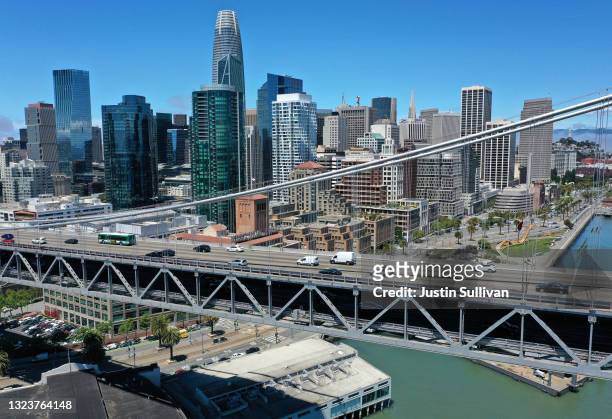 In an aerial view, traffic crosses the San Francisco-Oakland Bay Bridge on June 14, 2021 in San Francisco, California. California, the first state in...