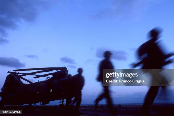 Us marines prepare for a mission on the flight deck of USS Wasp during the Bosnian War and North Atlantic Treaty Organisation air campaign against...
