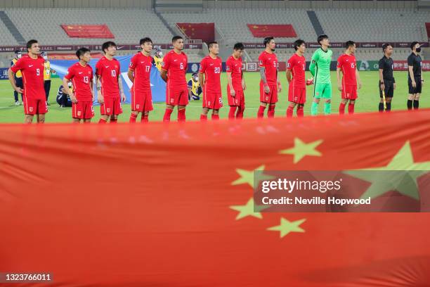 The China National Team stand for the national anthem during the 2022 FIFA World Cup Asian Qualifiers Group A between China and Syria at Sharjah...