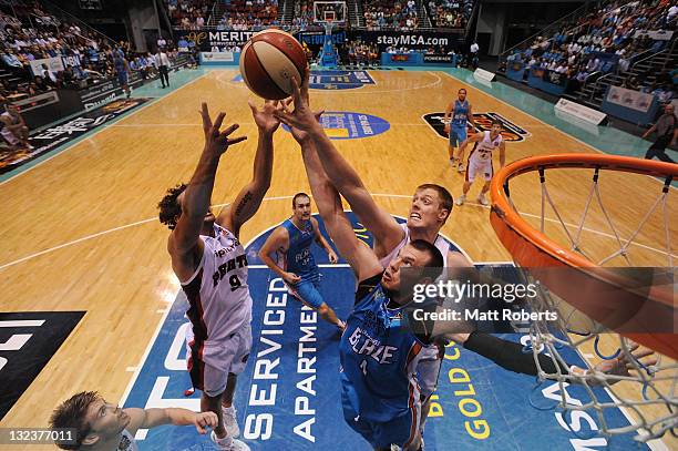 Will Hudson of the Blaze contests for the rebound with Matthew Knight and Luke Nevill of the Wildcats during the round six NBL match between the Gold...