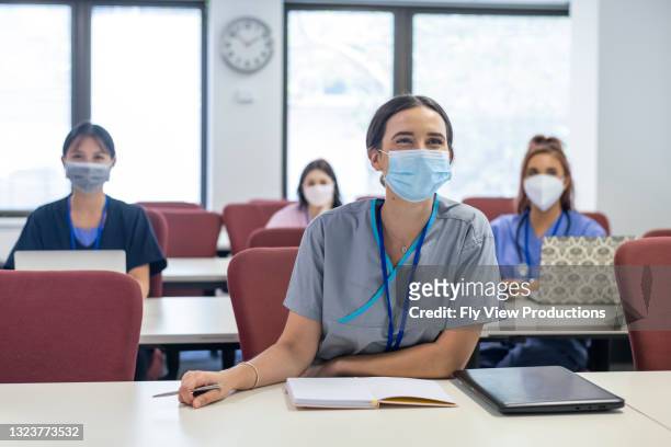 the future faces of our medical industry - social distancing classroom stockfoto's en -beelden