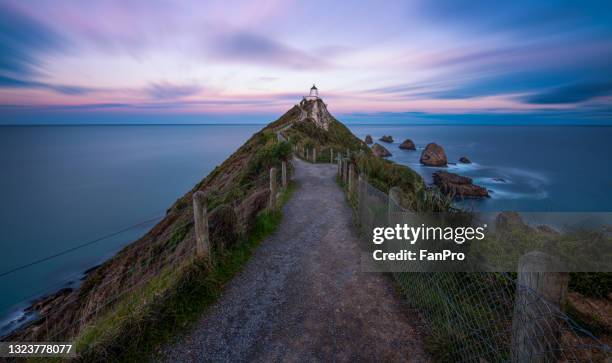 seaside lighthouse sunrise - red beacon stock pictures, royalty-free photos & images