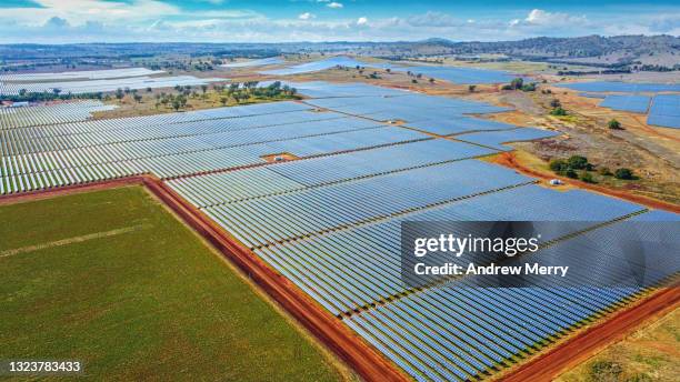 large solar power station, solar farm in rural australia, aerial view - australian pasture stock pictures, royalty-free photos & images