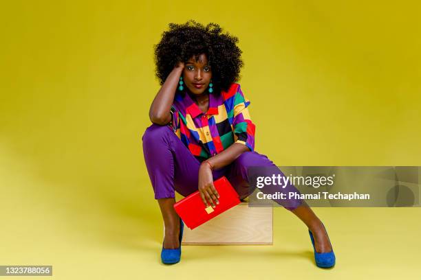 fashionable woman in colorful shirt - calzature multicolore foto e immagini stock