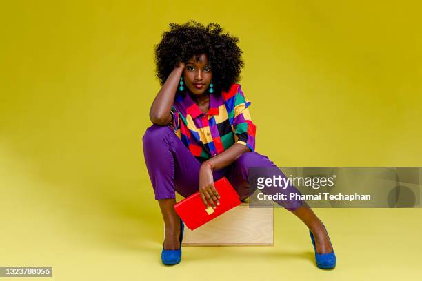 fashionable woman in colorful shirt - multi coloured shoe imagens e fotografias de stock