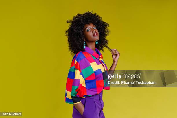 fashionable woman in colorful shirt - glamour stock-fotos und bilder