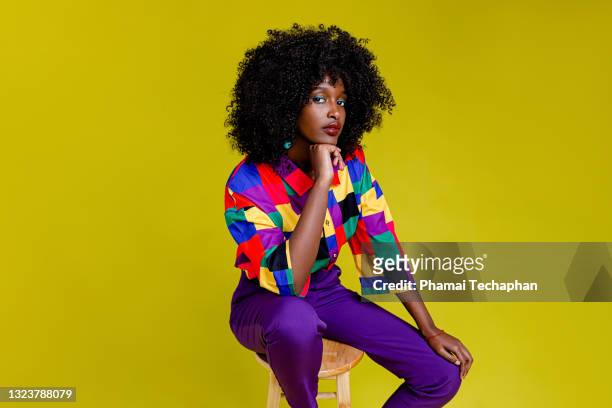 fashionable woman in colorful shirt - a la moda fotografías e imágenes de stock
