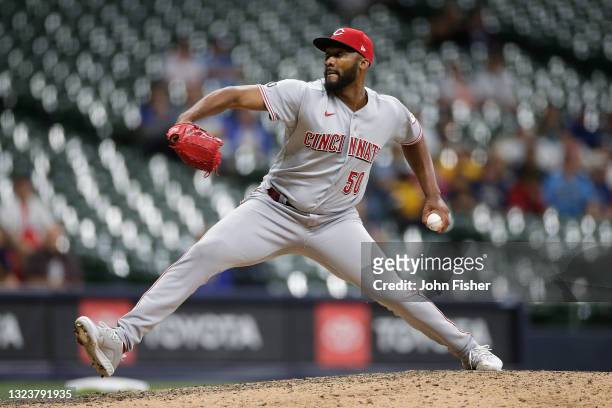 Amir Garrett of the Cincinnati Reds pitches for the final out in the tenth inning against the Milwaukee Brewers at American Family Field on June 15,...
