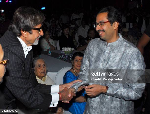 Amitabh Bachchan and Uddhav Thackeray attend the 25th year in the film industry of Nitin Chandrakant Desai's book launch on August 08, 2011 in...
