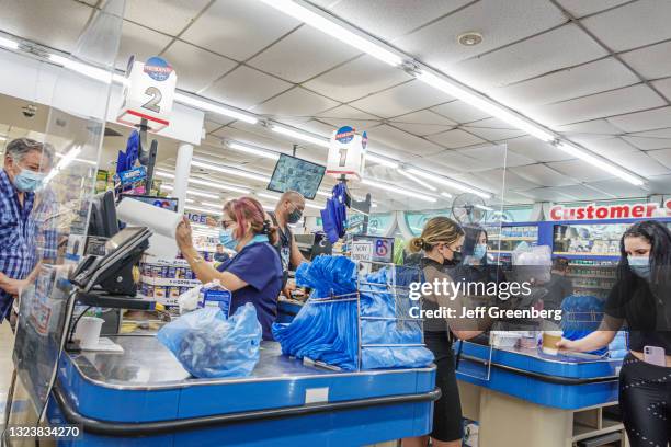 Florida, Miami Beach, El Presidente Supermarket, cashiers, checkout line.