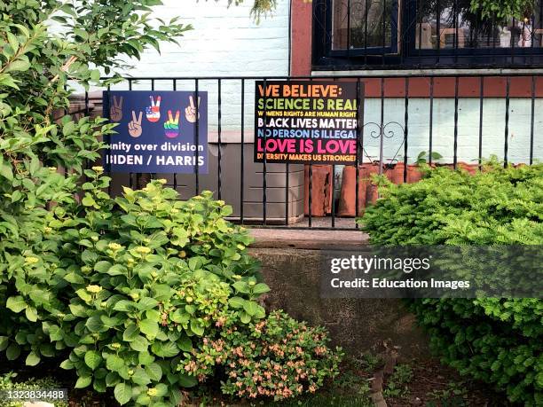 Equality over division signs in front yard, Rego Park, Queens, New York.