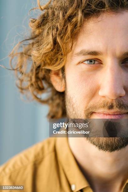 a close-up portrait of a handsome young man - inzoomen stockfoto's en -beelden