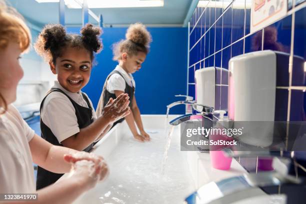 washing hands at school - disinfection school stock pictures, royalty-free photos & images