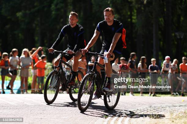 Tim Krul and Luuk de Jong of Netherlands arrive on a bike prior to the Netherlands Training Session ahead of the UEFA Euro 2020 Group C match between...