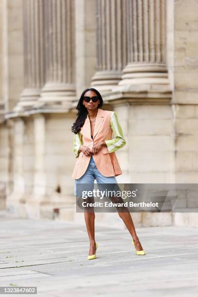 Emilie Joseph @in_fashionwetrust wears black sunglasses, a white and orange checked blazer from La Veste by Maria de la Orden with green and white...