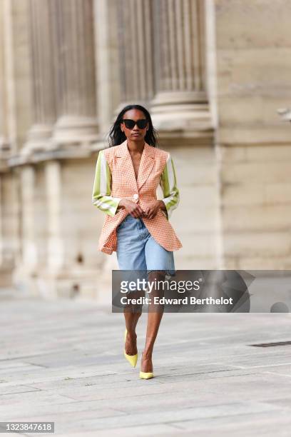 Emilie Joseph @in_fashionwetrust wears black sunglasses, a white and orange checked blazer from La Veste by Maria de la Orden with green and white...