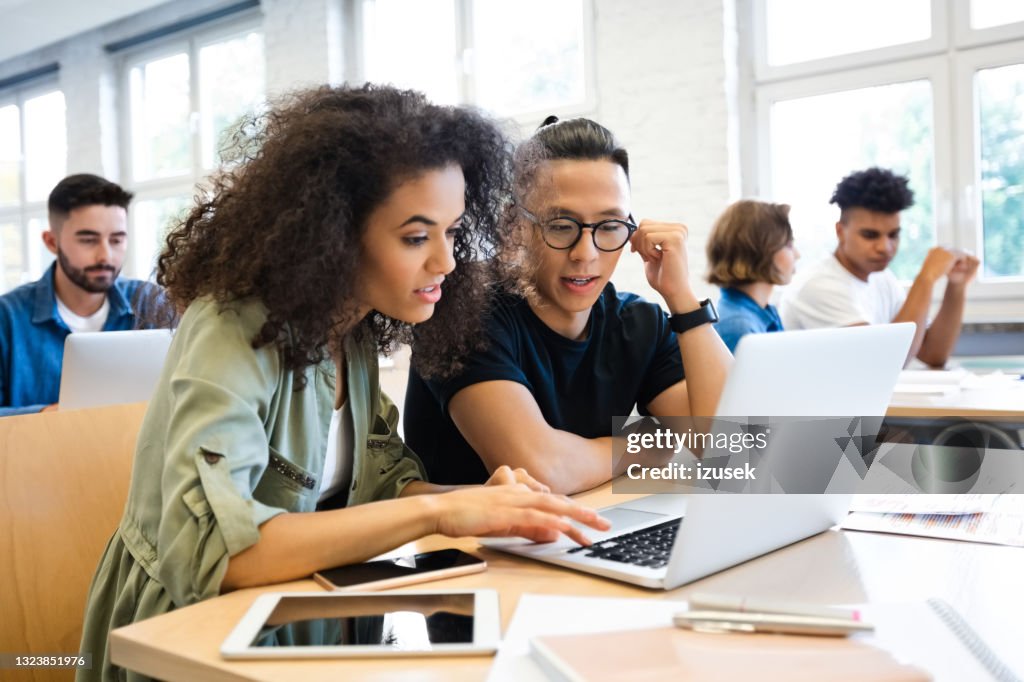 Classmates are learning through laptop