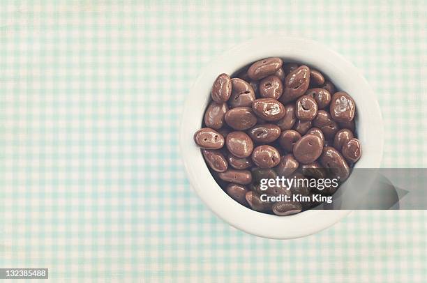 chocolate covered raisons - chocolate dipped stock pictures, royalty-free photos & images