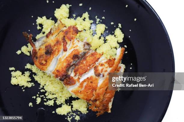 grilled slice of barramundi or asian sea bass fish served with couscous - バラマンディ ストックフォトと画像