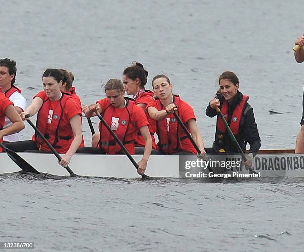 Catherine, Duchess of Cambridge rows in a dragon boat across Dalvay lake on July 4, 2011 in Charlottetown, Canada.