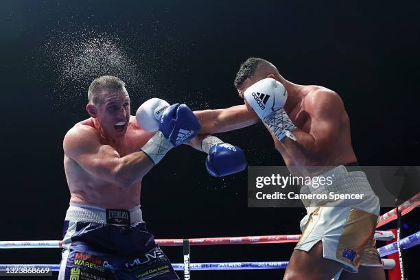 Justis Huni punches Paul Gallen during their Australian heavyweight title fightduring the Australian heavyweight title fight between Justis Huni and...