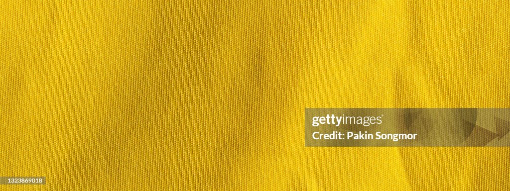 Yellow fabric cloth polyester texture and textile background.