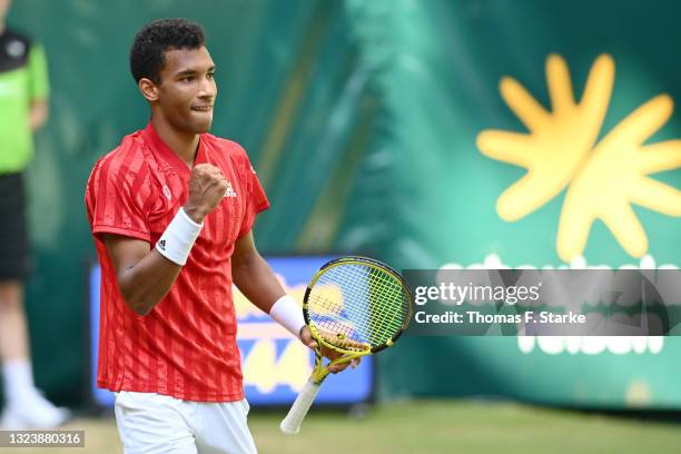 Felix Auger-Aliassime of Canada celebrates after winning his match against Roger Federer of Switzerland during day 5 of the Noventi Open at OWL-Arena...