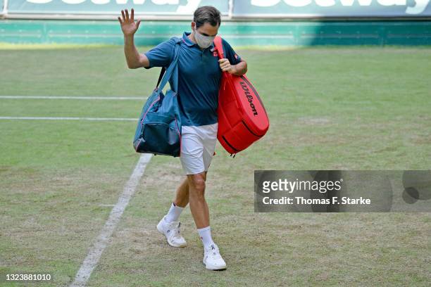 Roger Federer of Switzerland leaves the Center Court after losing his match against Felix Auger-Aliassime of Canada during day 5 of the Noventi Open...