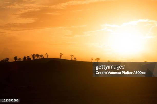scenic view of silhouette of landscape against sky during sunset,australia - country town australia stock pictures, royalty-free photos & images