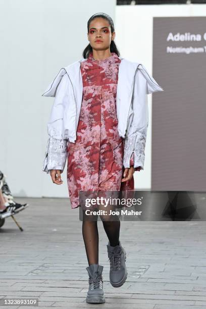 Model walks the runway wearing clothing by Designer Adelina Glodean during the Nottingham Trent University show during Graduate Fashion Week 2021 at...