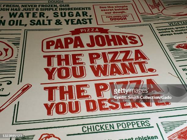 Close-up of logo on a box of Papa John's Pizza in Lafayette, California, May 2, 2021.