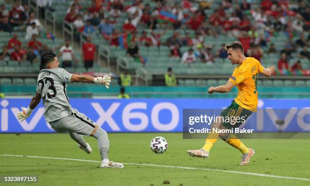 Aaron Ramsey of Wales scores their side's first goal past Ugurcan Cakir of Turkey during the UEFA Euro 2020 Championship Group A match between Turkey...