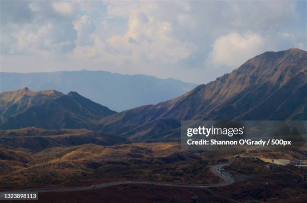 scenic view of mountains against sky,mount aso,japan - kumamoto prefecture stock pictures, royalty-free photos & images