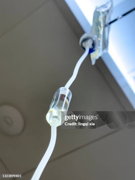 infusion bottles and infusion pumps in the infusion room in the hospital - iv pump stock pictures, royalty-free photos & images