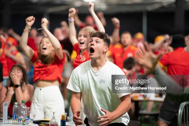 Football fans react as they watch Wales v Turkey at the Vale Sports Arena on June 16, 2021 in Penarth, Wales. The 2020 UEFA European Championship was...