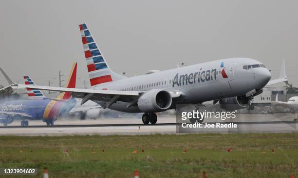 An American Airlines plane lands at the Miami International Airport on June 16, 2021 in Miami, Florida. Miami International Airport, founded in 1928,...