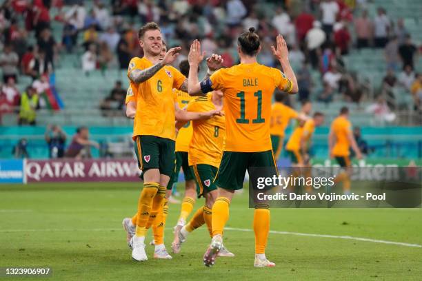 Joe Rodon of Wales celebrates with team mate Gareth Bale after team mate Connor Roberts scores their side's second goal during the UEFA Euro 2020...