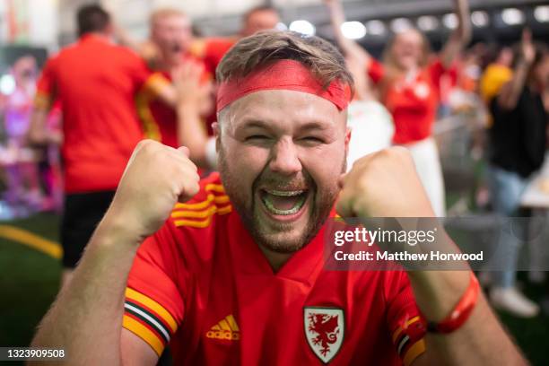 Football fans react as they watch Wales v Turkey at the Vale Sports Arena on June 16, 2021 in Penarth, Wales. The 2020 UEFA European Championship was...