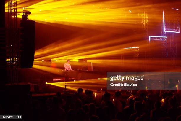 dj playing on the stage in summer - dj set stock pictures, royalty-free photos & images